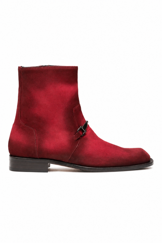 Wine red suede Mezlan ankle boot featuring a signature horse-bit detail and a sleek asymmetrical toe.