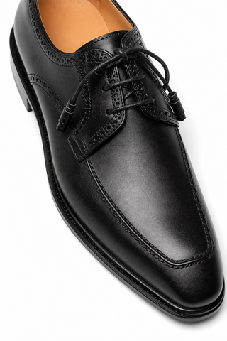 Mezlan Hatley black calf-skin leather derby shoe with square toe, brogue detailing, and lace-up closure.