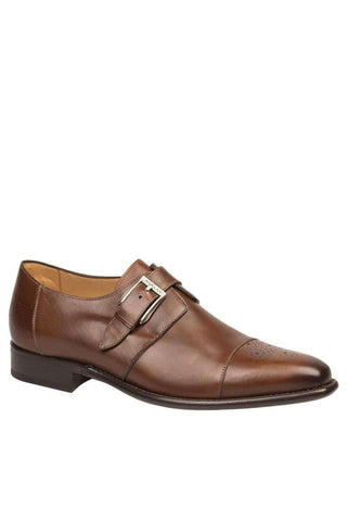 Cognac calf-skin leather Mezlan single monk-strap shoe with a medallion cap toe and silver buckle.