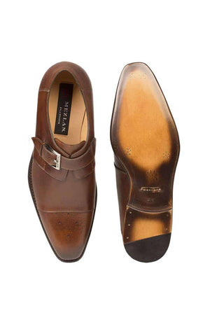 Cognac calf-skin leather Mezlan single monk-strap shoe with a medallion cap toe and full leather sole.