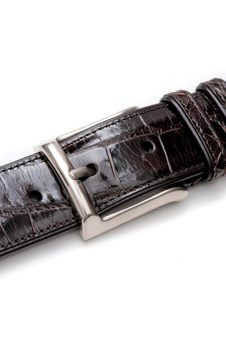 Brown Mezlan alligator skin belt with a polished silver buckle and textured leather finish.