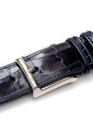 Blue Mezlan alligator skin belt with a polished silver buckle and high-gloss finish, handcrafted in Spain.