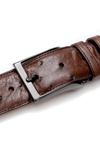 Mezlan brandy ostrich skin belt with a sleek satin platinum buckle.