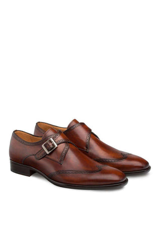 Cognac hand-burnished calf-skin leather wing-tip single monk-strap shoes with perforated detailing.