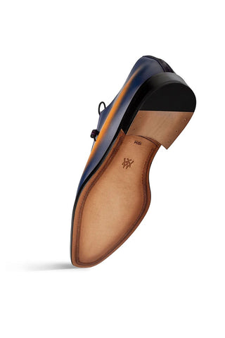 Mezlan Bretton blue suede and leather Oxford shoe showing the tan leather sole and heel.
